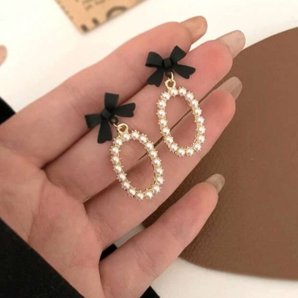 Bow pearl oval earrings Anthropologie